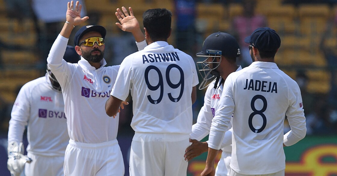 Indian players celebrate the dismissal of Kusal Mendis. Photo: AFP/Manjunath Kiran