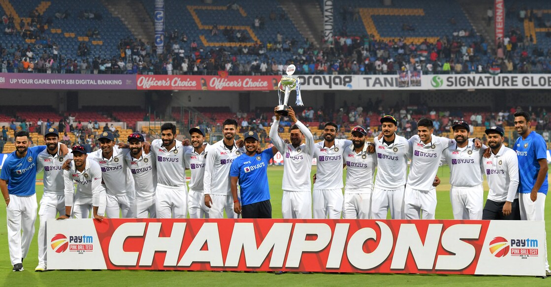 Indian players pose with the trophy after winning the Test series against Sri Lanka. Photo: AFP/Manjunath Kiran