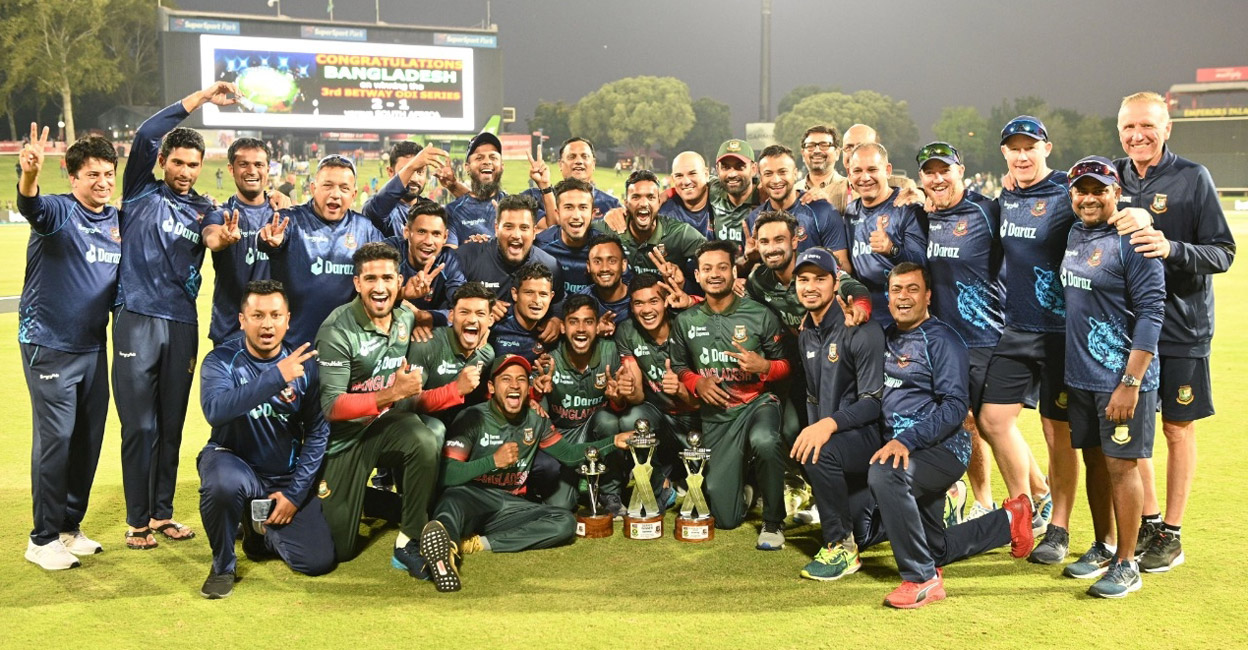 Bangladesh players and support staff celebrate their historic win. Photo: IANS
