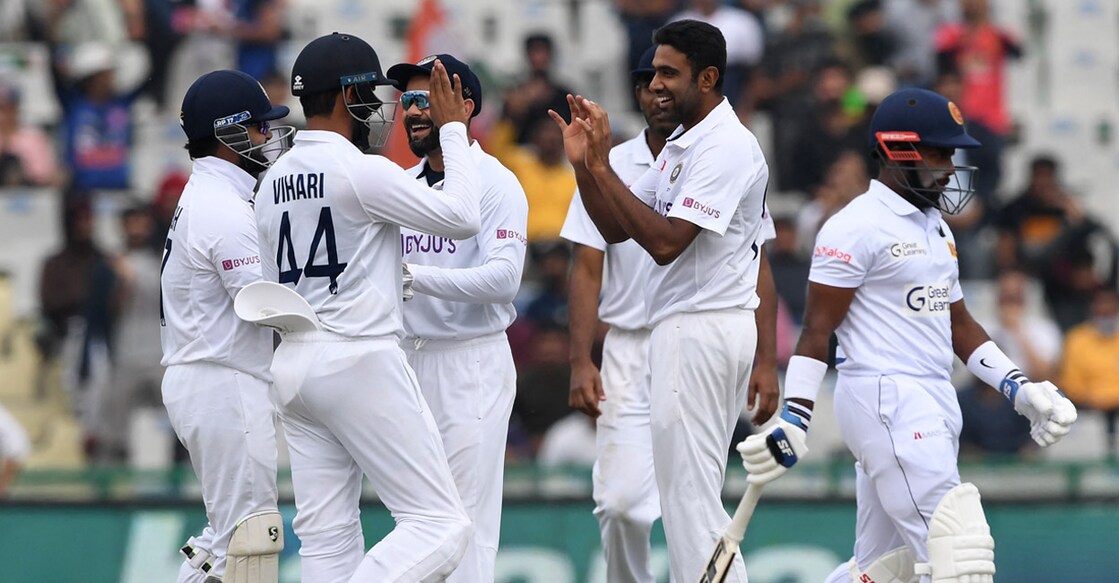R Ashwin celebrates with teammates after sending back Charith Asalanka to go past Kapil Dev. Photo: AFP/Prakash Singh