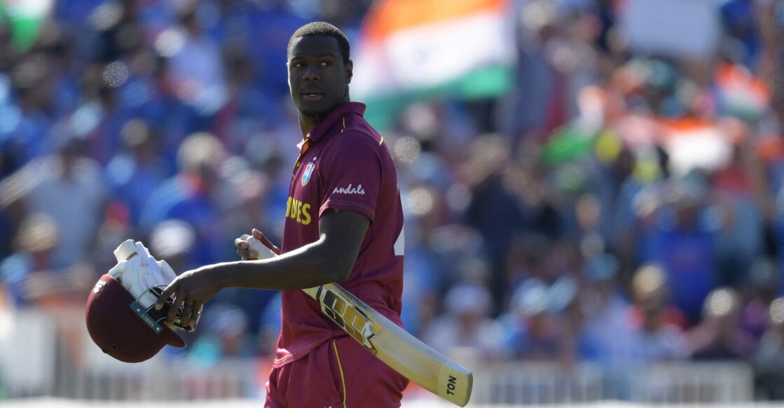 Carlos Brathwaite returns to the pavilion after getting out in the 2019 ICC World Cup match against India. File photo: AFP/Dibyangshu Sarkar