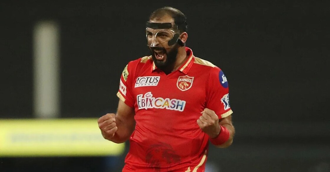 Rishi Dhawan exults after picking up a wicket. Photo: IANS