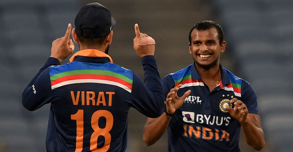 Virat Kohli and T Natarajan celebrate the dismissal of Ben Stokes in the third ODI against England in 2021. File photo: AFP/Punit Paranjpe
