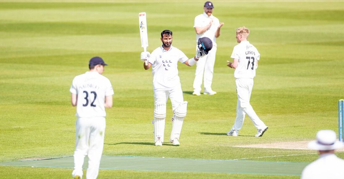 Cheteshwar Pujara celebrates his double hundred. Photo: IANS
