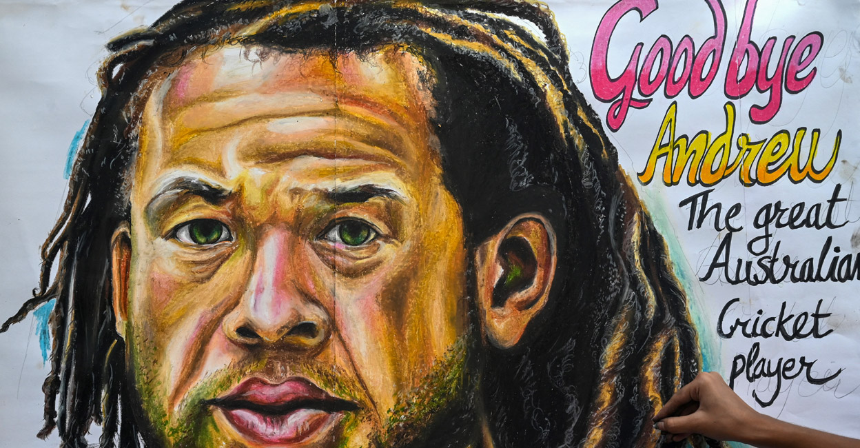 An art student gives final touches to a painting of the late Andrew Symonds in Mumbai on May 15, 2022. File photo: AFP/Indranil Mukherjee