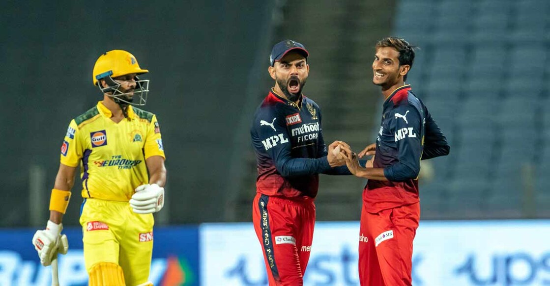 Shahbaz Ahmed and Virat Kohli of Royal Challengers Bangalore celebrate the wicket of Ruturaj Gaikwad of Chennai Super Kings. IPL/PTI