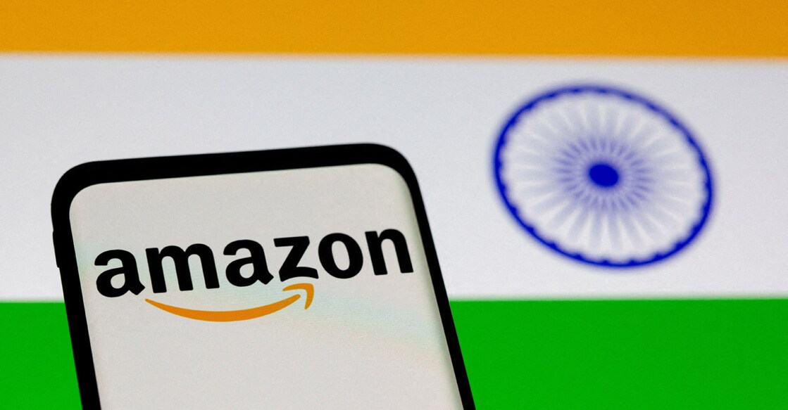 Smartphone with Amazon logo is seen in front of the displayed Indian national flag . File photo: Reuters/Dado Ruvic