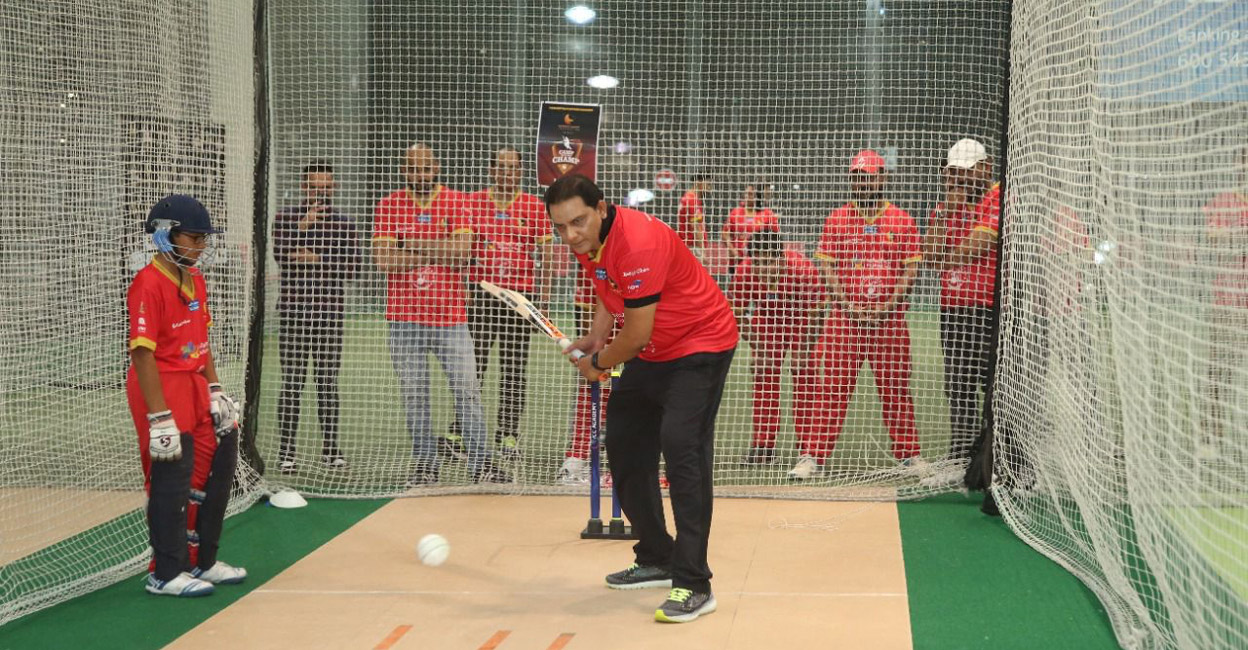 Mohammad Azharuddin offers tips to a youngster. Photo: By Special Arrangement
