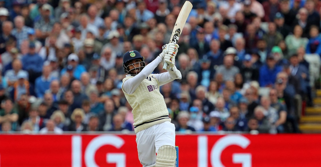 Jasprit Bumrah plays a big hit. Photo: AFP/Geoff Caddick