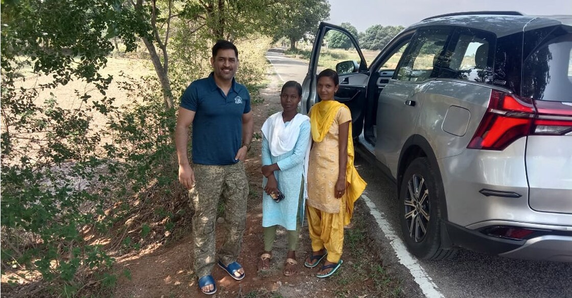 M S Dhoni with a couple of his fans. Photo: IANS