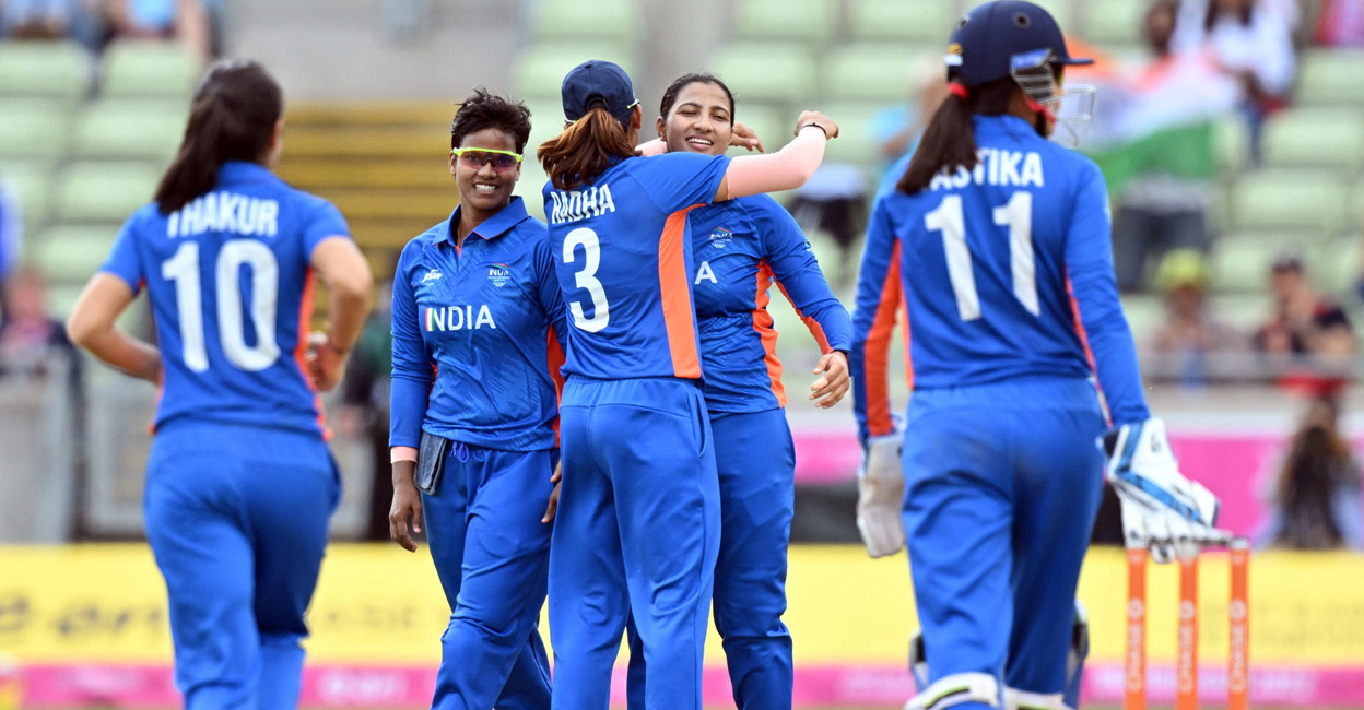 Indian players congratulate Sneh Rana, second right, on picking up a wicket.Photo: Twitter@BCCIWomen