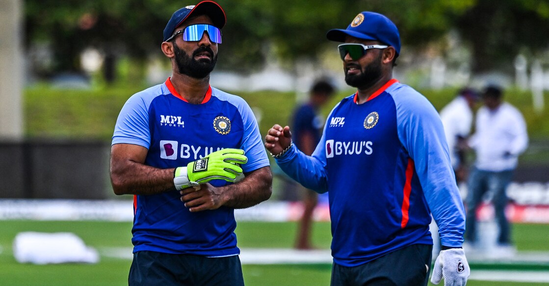 Dinsh Karthik and Rishabh Pant are fighting for a palce in the playing eleven. File photo: AFP/Chandan Khanna