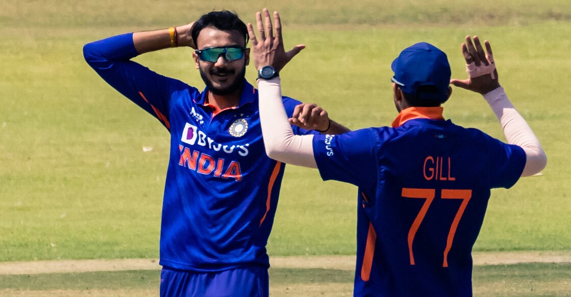Axar Patel celebrates with Shubman Gill after picking up a wicket in the third ODI agaianst Zimbabwe. Photo: AFP/Jekesai Njikizana
