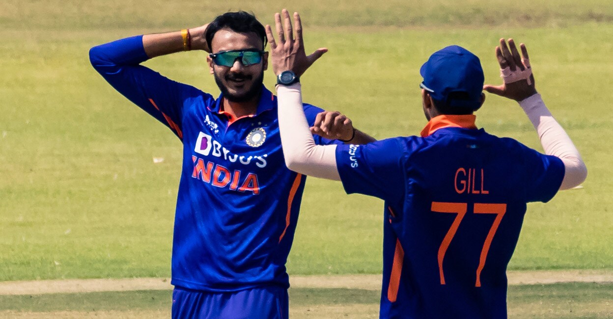 Axar Patel celebrates with Shubman Gill after picking up a wicket in the third ODI agaianst Zimbabwe. Photo: AFP/Jekesai Njikizana
