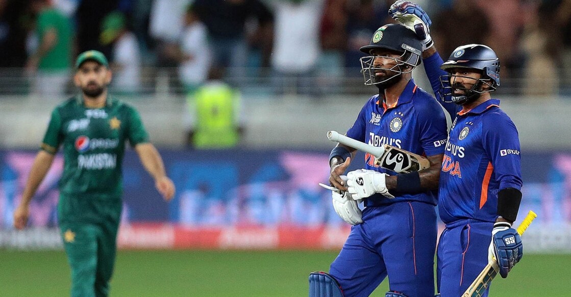 Hadrik Pandya and Dinesh Karthik celebrate India's win. Photo: IANS