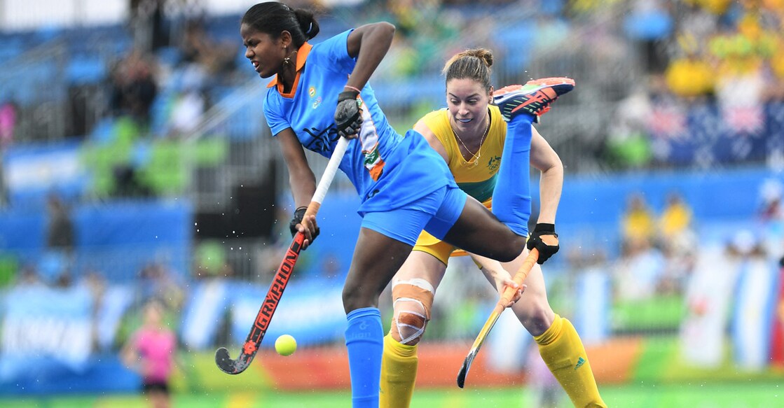 Namita Toppo and Australia's Karri McMahon fight for possession in the 2016 Rio Olympics. File photo: AFP/Manan Vatsyayana