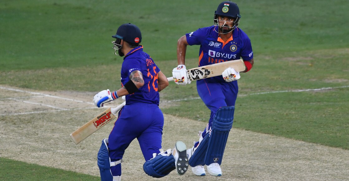 Virat Kohli and K L Rahul pick up a single during the Asia Cup match against Afghanistan. File photo: AFP/Ryan Lim