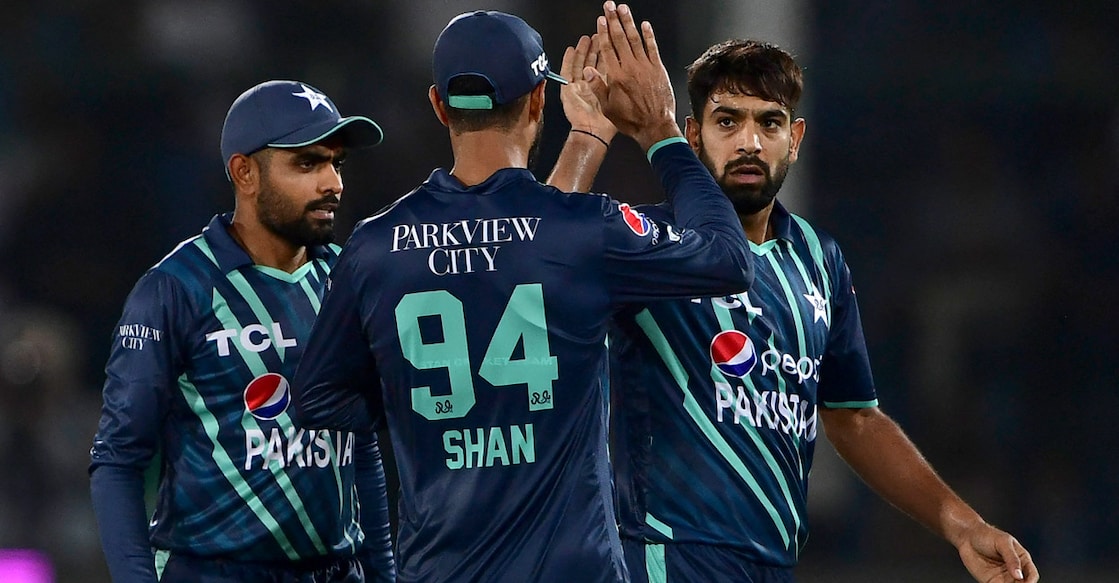 Haris Rauf, right, celebrates with teammates after dismissing Harry Brook. Photo: AFP/Asif Hassan