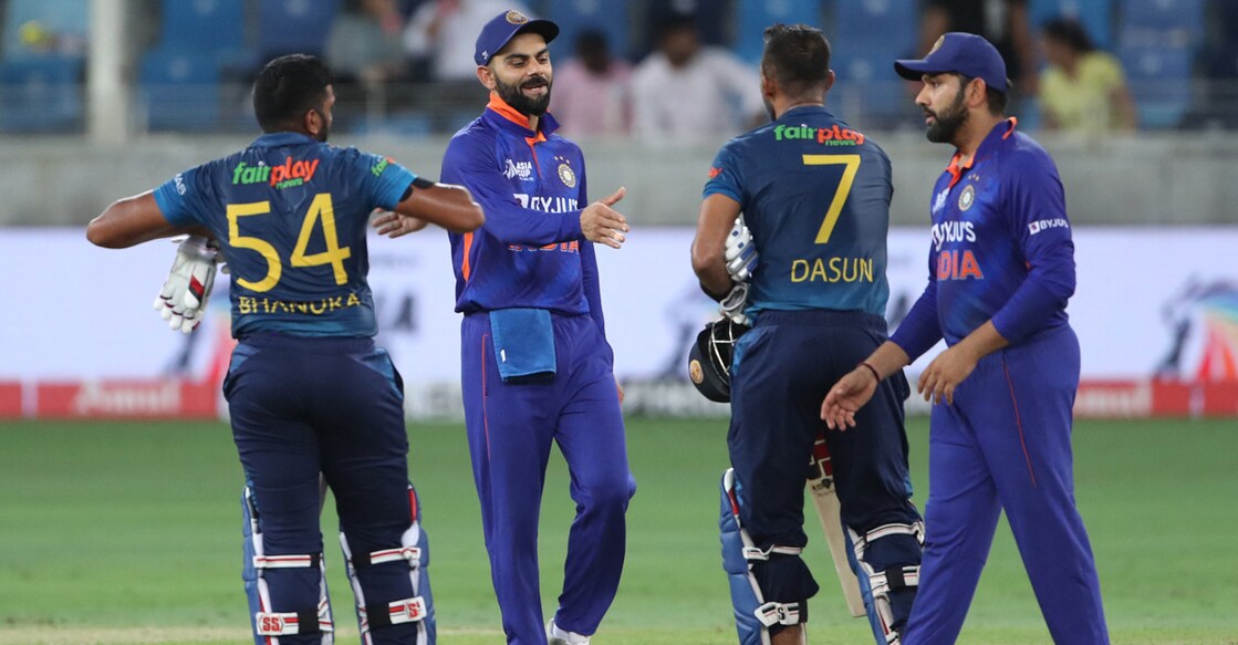 India's captain Rohit Sharma (R) and Virat Kohli (2L) greet Sri Lanka's Bhanuka Rajapaksa (L) and captain Dasun Shanaka at the end of the Asia Cup Twenty20 international cricket Super Four match between India and Sri Lanka at the Dubai International Cricket Stadium in Dubai on September 6, 2022. Photo: SURJEET YADAV / AFP