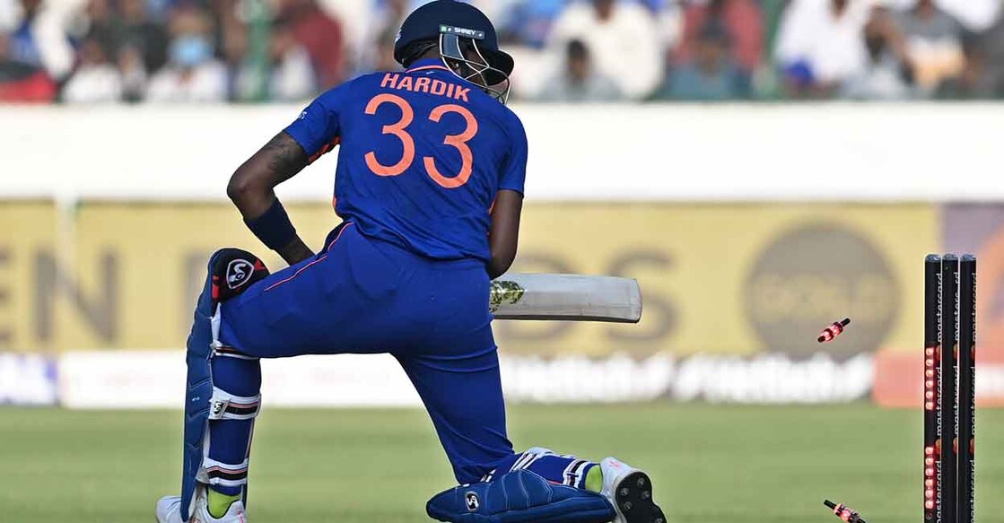 Hardik Pandya looks back as the bails come off. Photo: AFP/Noah Seelam