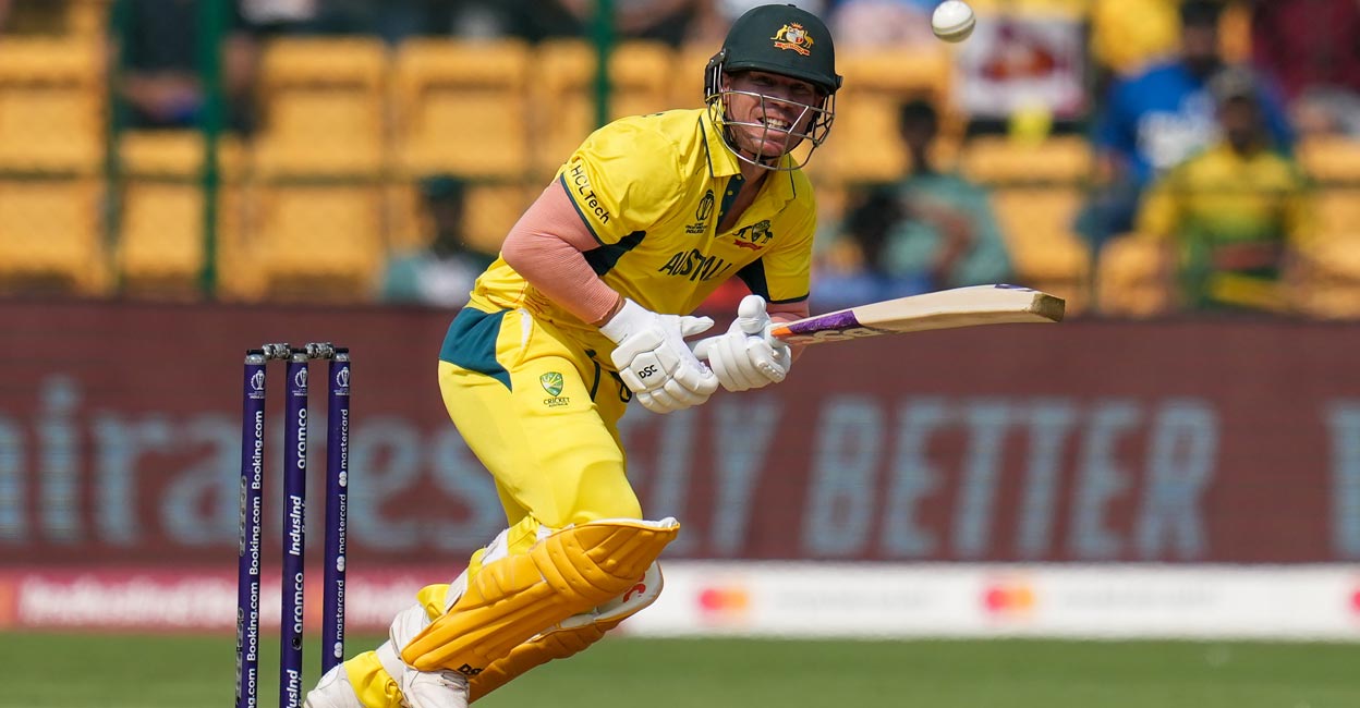 David Warner plays a shot. Photo: PTI/Shailendra Bhojak
