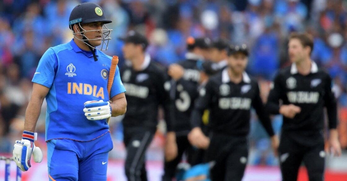 Dhoni walks back after being run out in the 2019 World Cup semifinal. File photo: AFP/Dibyangshu Sarkar