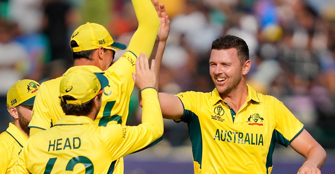 Australia's Josh Hazlewood, right, celebrates with teammates after dismissing Devon Conway. Photo: PTI/Ravi Choudhary