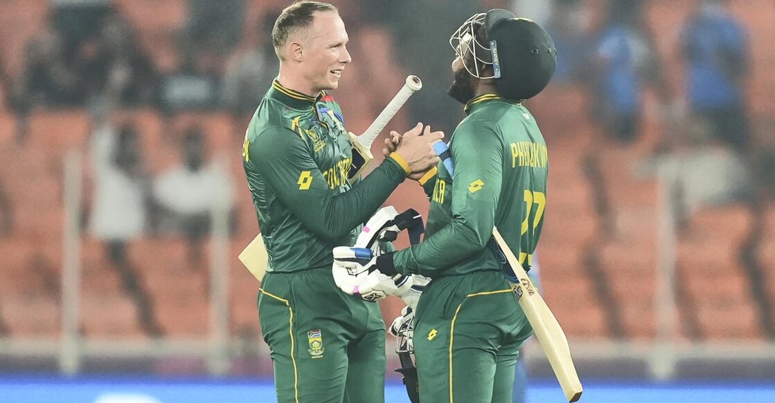Rassie van der Dussen and Andile Phehlukwayo celebrate their win over Afghanistan. Photo: PTI/Arun Sharma