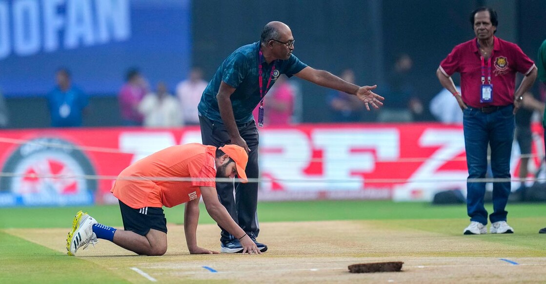 Indian captain Rohit Sharma inspects the Wankhede Pitch ahead of the semifinal. File photo: PTI/Shailendra Bhojak