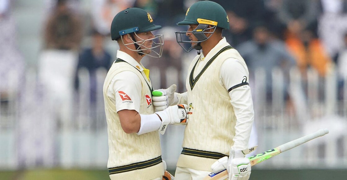 Usman Khawaja, right, has batted for his opening partner David Warner. File photo: AFP/Farooq Naeem