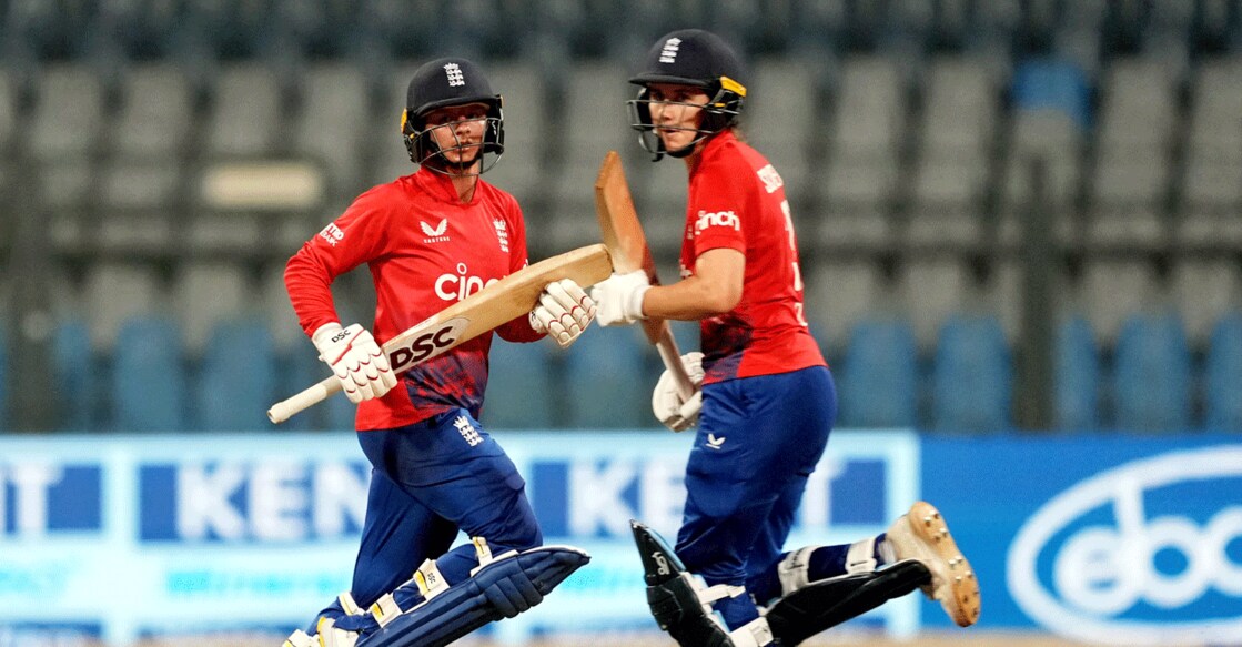 England's Nat Sciver-Brunt and Danielle Wyatt run between the wickets during the 1st T20I against India at Wankhede Stadium in Mumbai on Wednesday. Photo: PTI