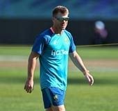 Warner shrugs off Johnson's scathing attack