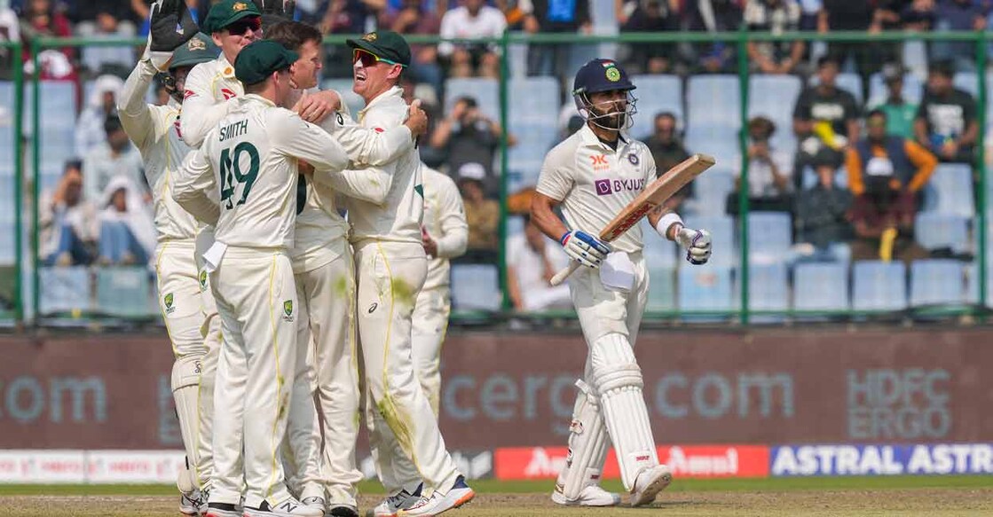 Australian bowler Matthew Kuhnemann celebrates with teammates after the wicket of Indian batter Virat Kohli. Photo: PTI