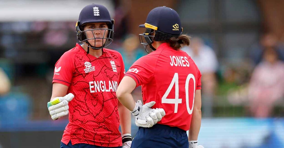 England's Nat Sciver-Brunt (left) and England's Amy Jones talk between overs during the Group B T20 women's World Cup cricket match against India. Photo: AFP/ Marco Longari