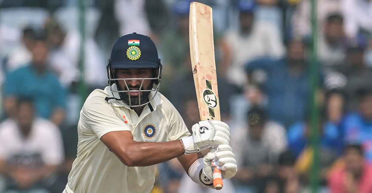Cheteshwar Pujara plays a shot on the third day of the New Delhi Test. Photo: AFP/Money Sharma