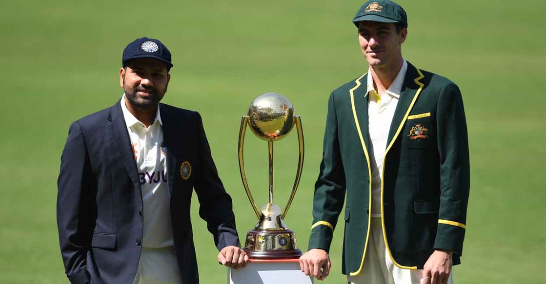 Indian captain Rohit Sharma and his Australian counterpart Pat Cummins pose with the Border-Gavaskar Trophy. Photo: AFP/Indranil Mukherjee