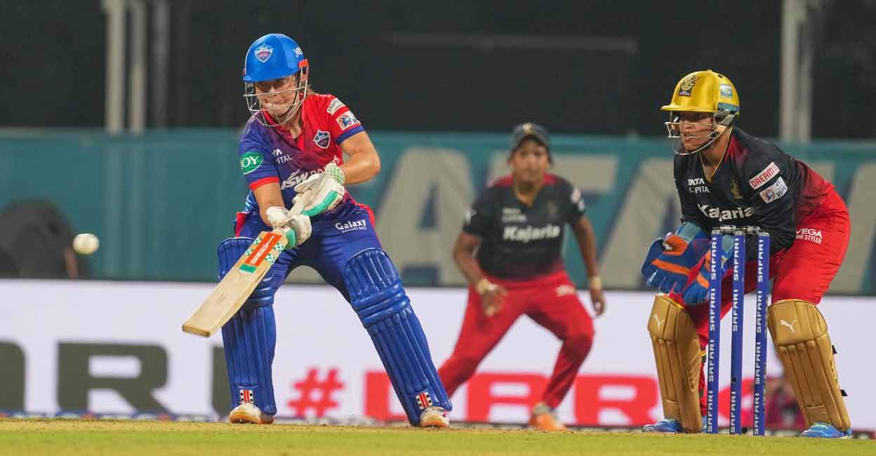 Delhi Capitals player Alice Capsey plays a shot against the Royal Challengers Bangalore during the Women's Premier League (WPL) in Navi Mumbai on Monday. Photo: PTI