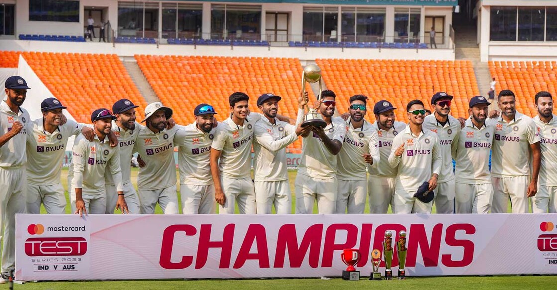 Indian cricketers pose for photos with the trophy after the end of the fourth test cricket match between India and Australia, at Narendra Modi Stadium in Ahmedabad. Photo: PTI/Atul Yadav