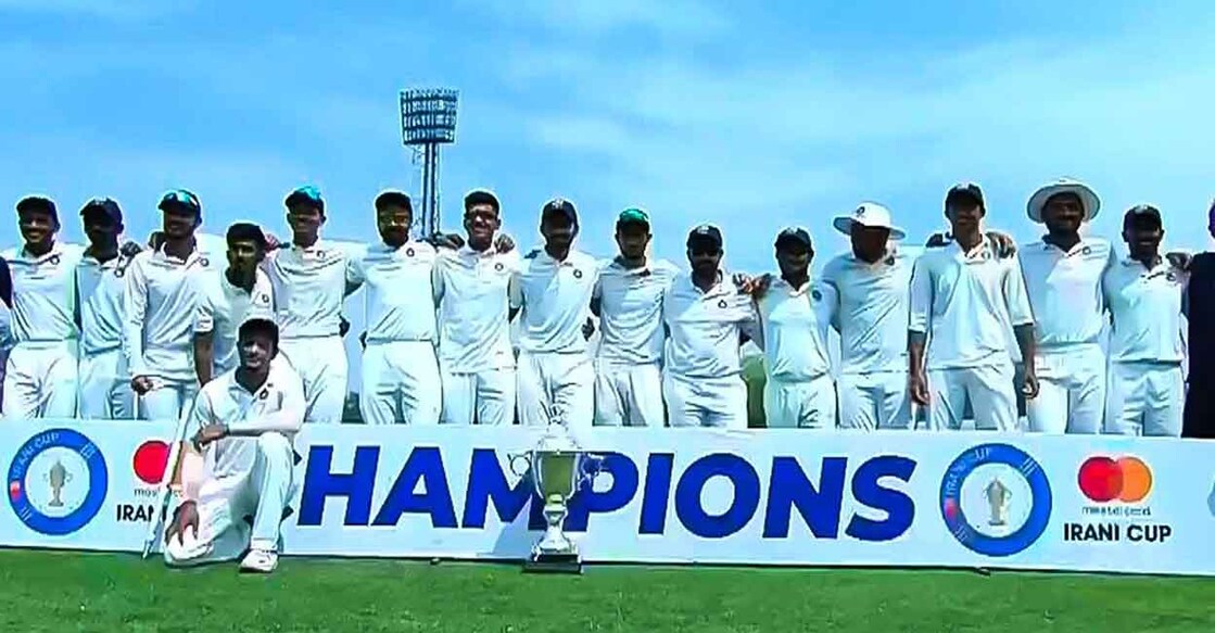 Rest of India players pose with the Irani Cup. Photo: Twitter@BCCIdomestic