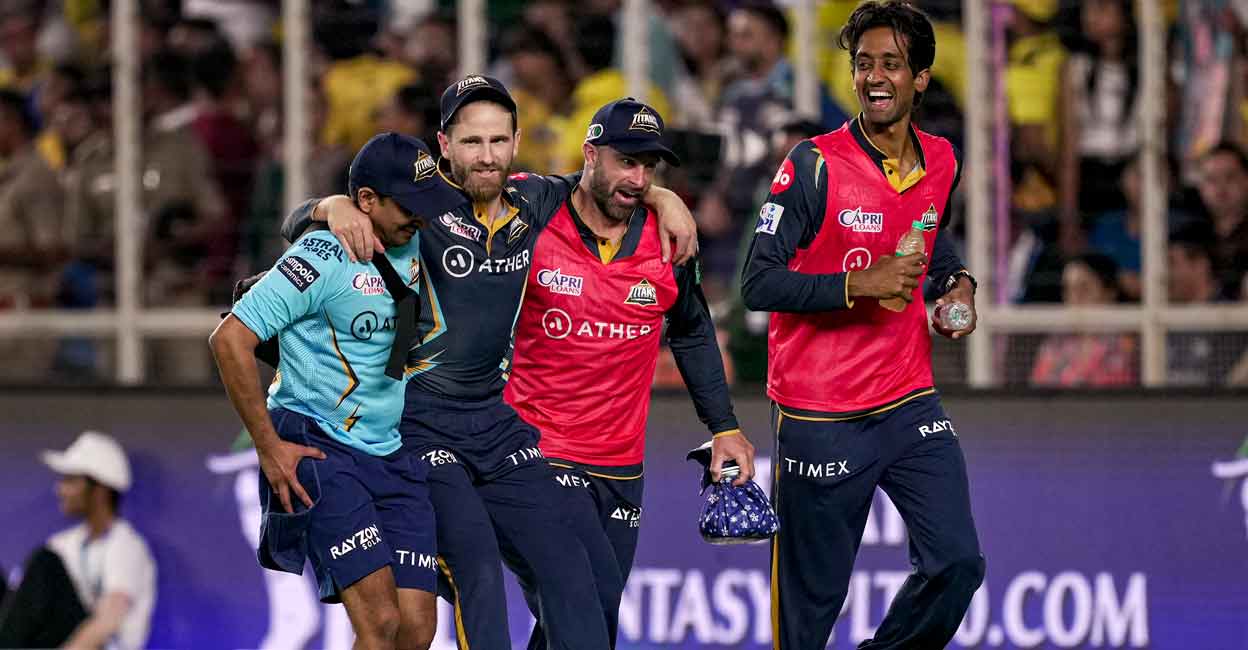 Kane Williamson being helped off the field. Photo: PTI/Kunal Patil