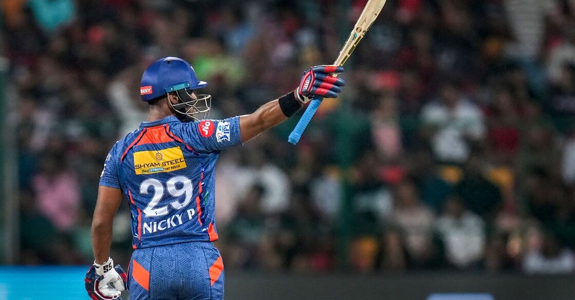 Lucknow Super Giants batter Nicholas Pooran celebrates after scoring a half-century during the IPL 2023 cricket match between Royal Challengers Bangalore and Lucknow Super Giants, at M Chinnaswamy Stadium in Bengaluru, Monday, April 10, 2023. Photo: PTI