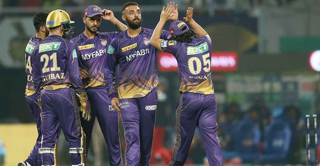 Varun Chakravarthy, second right, celebrates with KKR teammates after picking up a wicket. Photo: Twitter@IPL 