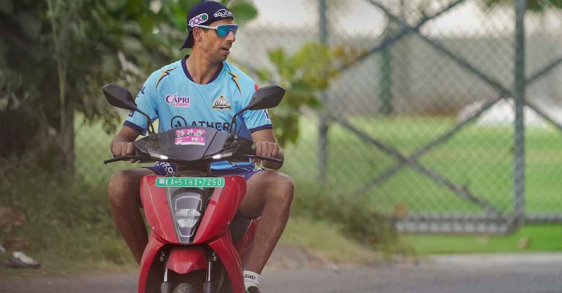 Ashish Nehra rding a bike ahead of a practice session. File photo: PTI/Kunal Patil