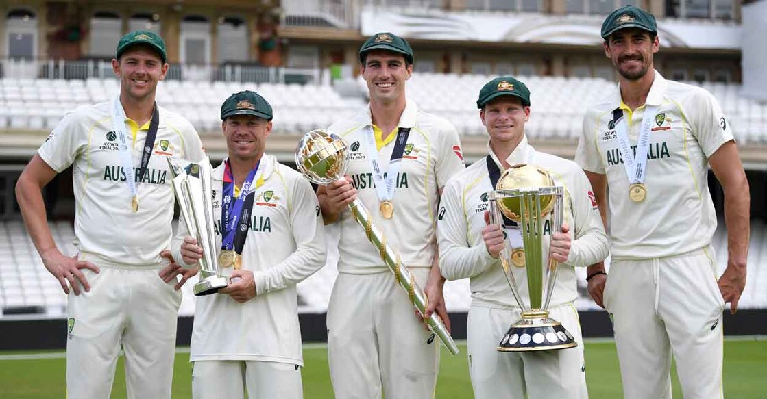 From left: Josh Hazlewood, David Warner, Pat Cummins, Steve Smith and Mitchell Starc pose with the trophies. Photo: Twitter@ICC