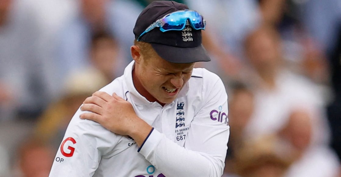 Ollie Pope walks off for medical attention after injuring his shoulder while fielding. Photo: Action Images via Reuters/Peter Cziborra