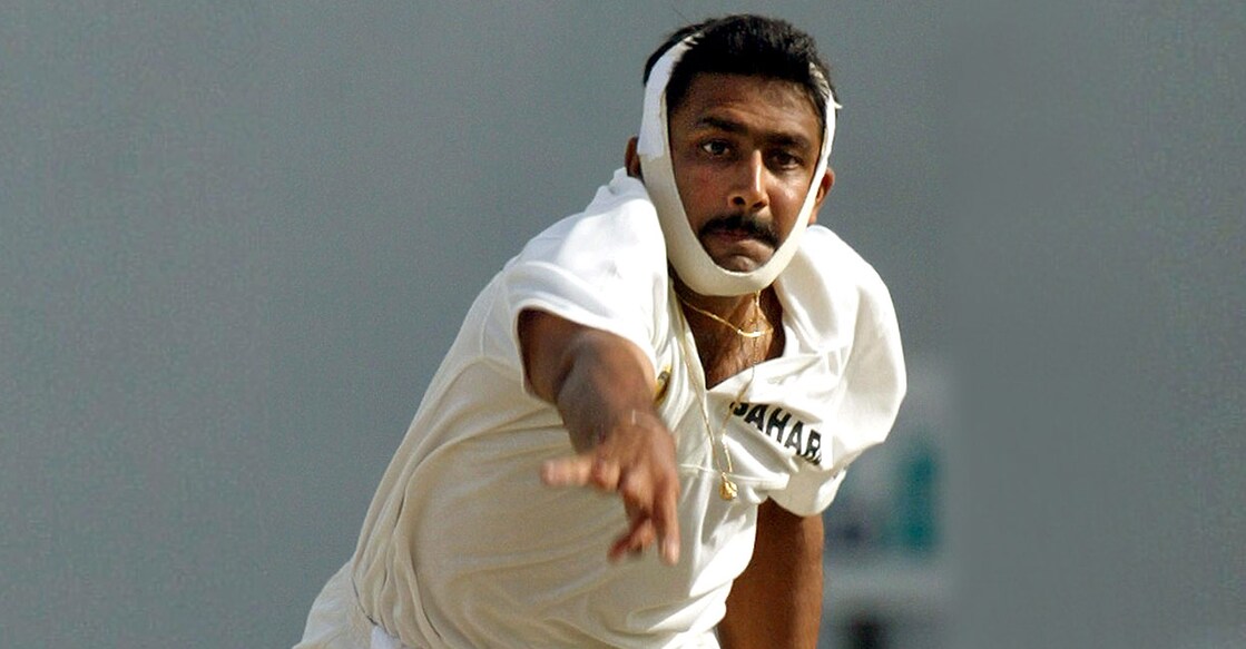Anil Kumble bowls with a broken jaw during the 2002 Antigua Test. File photo: AFP/Timothy A Clary