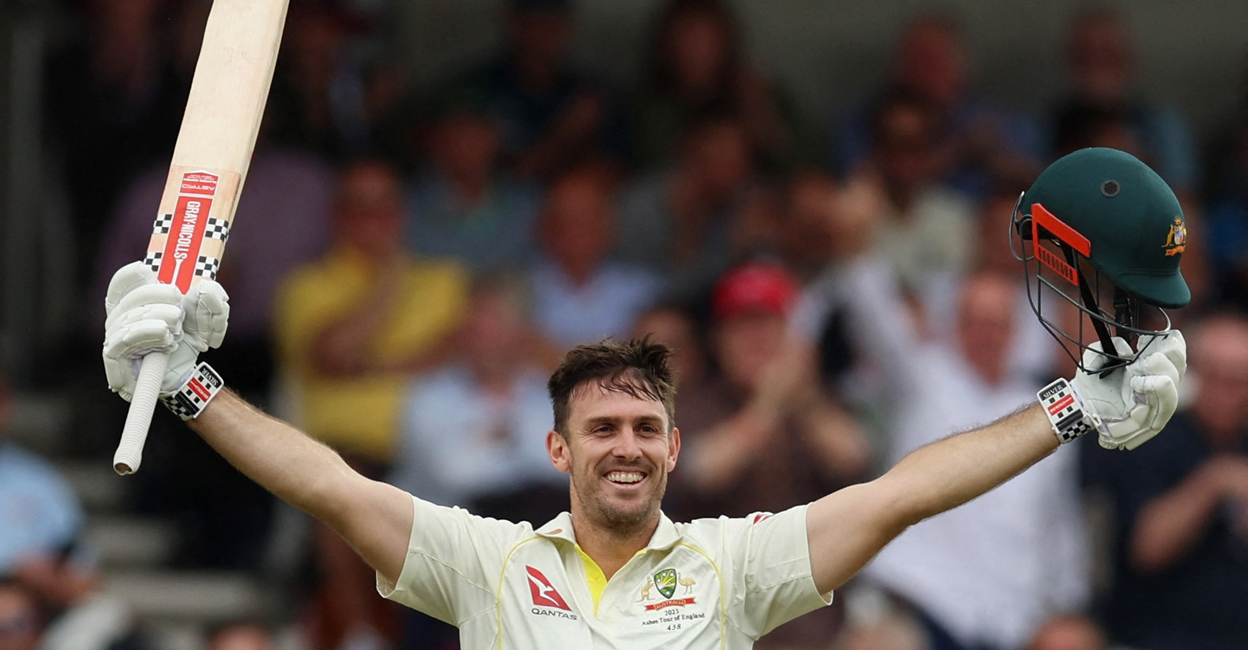 Australia's Mitchell Marsh celebrates after reaching his century. Photo: Reuters/Lee Smith