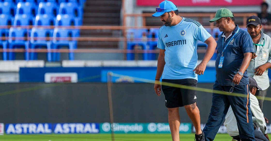 Rohit Sharma inspects the pitch at Rajkot. Photo: PTI/ Shashank Parade