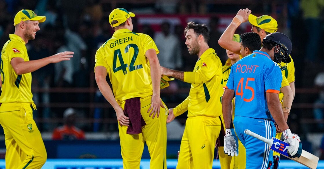 Glenn Maxwell, third left, celebrates with teammates after dismissng Rohit Sharma. Photo: PTI/Shashank Parade