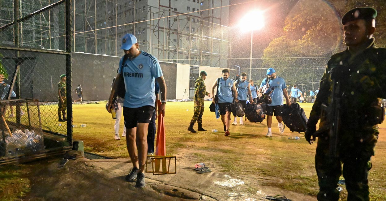 Indian players leave the practice area due to rain at the R Premadasa Stadium in Colombo on Friday. Photo: AFP/Farooq Naeem